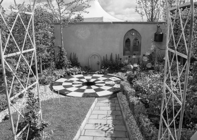 A round checkerboard design in a show garden at the Malvern show